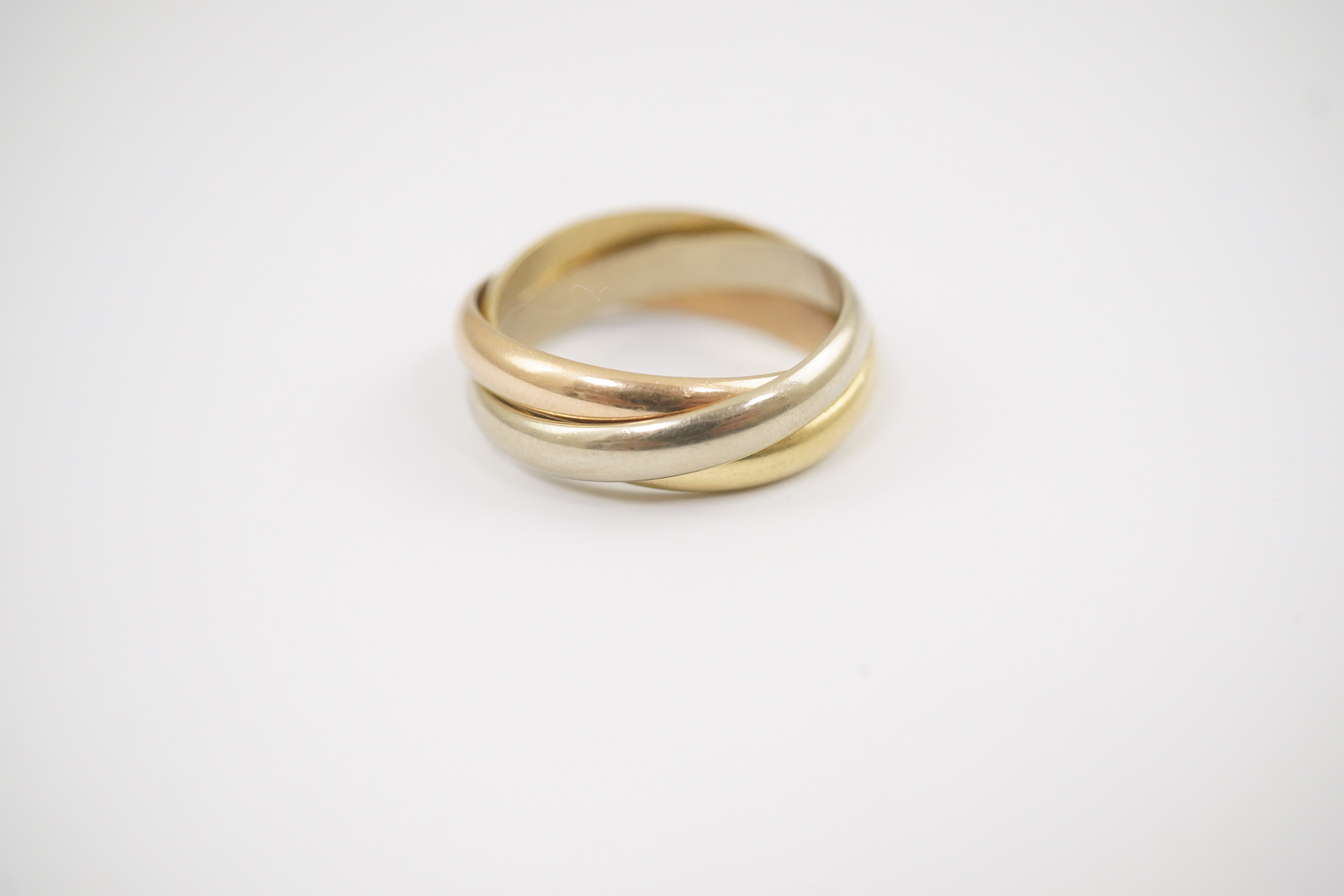 A modern Must De Cartier three colour 18k gold triple band 'Russian' wedding ring